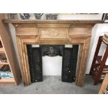 A cast iron fire place with pine surround (shelf 147 x 18cm) (collect only)