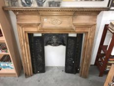 A cast iron fire place with pine surround (shelf 147 x 18cm) (collect only)