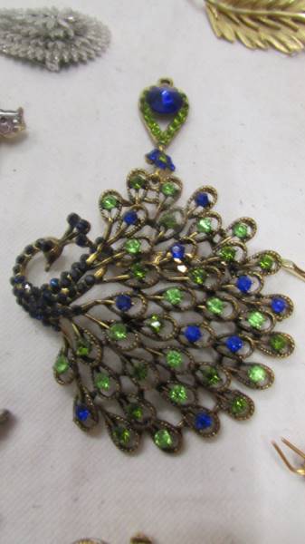 A peacock pendant/brooch and ten other brooches. - Image 2 of 4