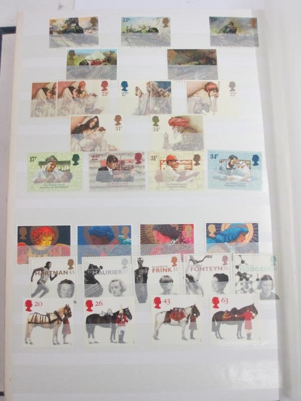 A good album of mint definitive stamps and sets (some in strips, many with gutter sides), - Image 8 of 13