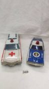 A large Japanese A1 HSAKUSA tinplate battery operated Buick ambulance and an un-named police Ford