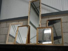 Five assorted mirrors.