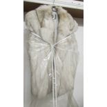 A Saga fox fur coat, size medium.