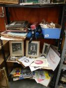 Three shelves of books and pamphlets including war related, religious, theatre programmes etc.