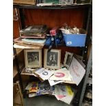 Three shelves of books and pamphlets including war related, religious, theatre programmes etc.