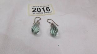 A pair of silver set briolette ear pendants.