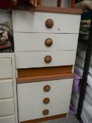 A pair of three drawer bedsides.