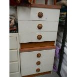 A pair of three drawer bedsides.