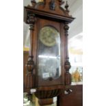 A Victorian 8 day wall clock with key,