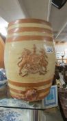 A stoneware barrel with a coat of arms.