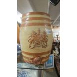 A stoneware barrel with a coat of arms.