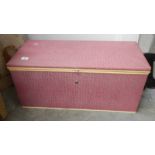 A modern pink ottoman.