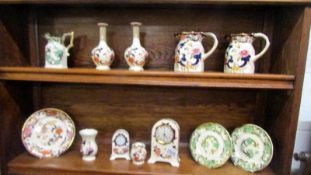 Three Mason's ironstone jugs, pair of vases, 2 clocks, 3 plates and 2 other items.