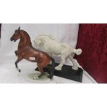 A Goebel horse and a Beswick horse.