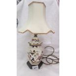 An oriental style table lamp with shade.