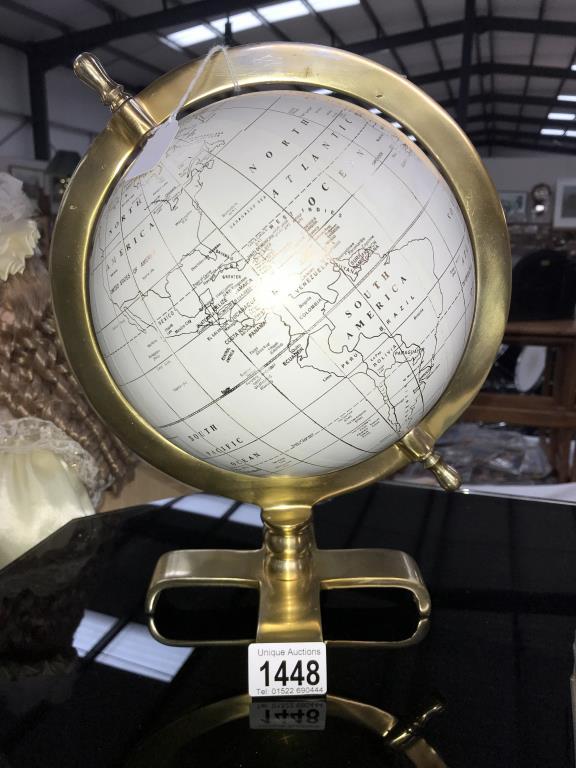 A globe on brass base