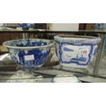 A large blue and white bowl together with a blue and white planter.