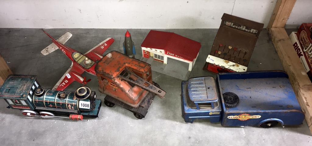 A selection of large play worn tin plate toys in various conditions