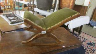 A mahogany gout stool.