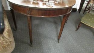 A mahogany D shaped hall table.