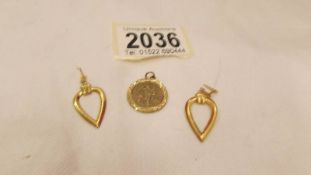 A pair of 9ct gold earrings and a 9ct gold St. Christopher. 3.8 grams.