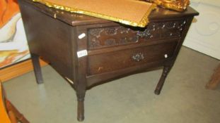 A two drawer oak chest.