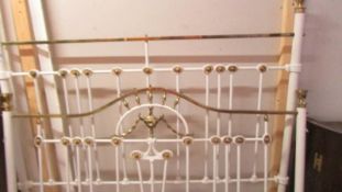 A Victorian brass and iron bedstead with side rails.