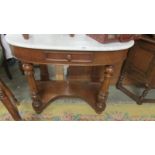 A Victorian mahogany Duchy style wash stand with white marble top.