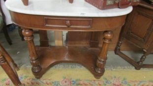 A Victorian mahogany Duchy style wash stand with white marble top.