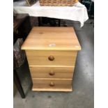 A pine effect bedside 3 drawer chest