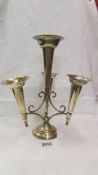 A silver plate four trumpet epergne.