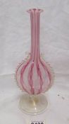 A Venetian Latticino vase with ribbon twist pattern in pink and white. In good condition.