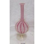 A Venetian Latticino vase with ribbon twist pattern in pink and white. In good condition.