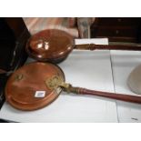 Two copper warming pans.