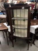 A display cabinet on legs (with key) A/F - 2 panes cracked