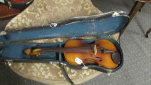 An old violin in hard case. ****Condition report**** No label inside violin.