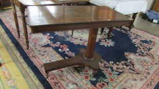 A 19th century rosewood reading table.