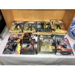 A collection of mainly unopened action figures comic & TV related including DC Harley Quinn with