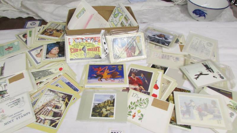 In excess of 200 assorted postcards, stamped envelopes etc.