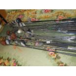 A large lot of vintage golf clubs.