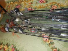 A large lot of vintage golf clubs.