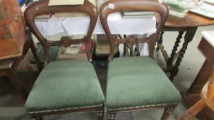 A pair of mahogany dining chairs.