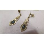 A pair of unmarked pendant earrings, (test as 9ct gold), 1.7 grams.