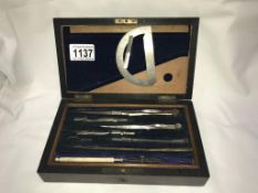 An Edwardian mahogany cased geometry set