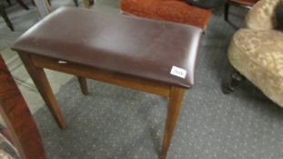 An organ stool with sheet music.