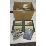 A box of general postcards.