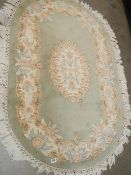 An oval Chinese rug.