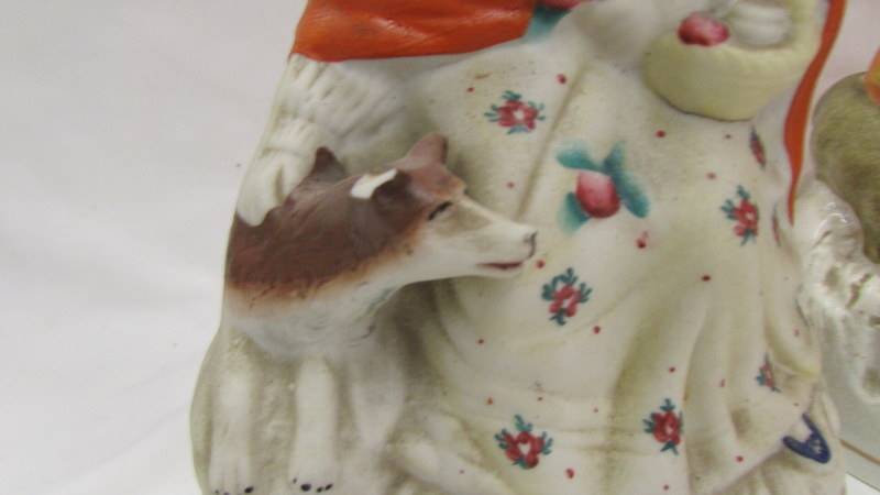 Two 19th century Staffordshire figures, one glazed, one unglazed, different colourways. - Image 4 of 4