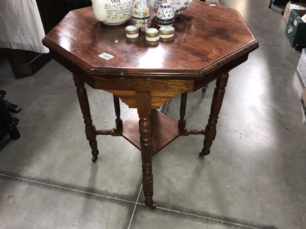 An Edwardian octagonal side table on turned legs