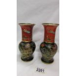 A pair of Carlton Ware black and terracotta New Mikdu Chinioserie vases.